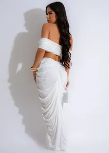 Back view detail of white ruched two-piece set with tube top and floor-length skirt