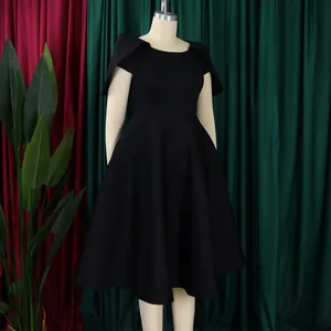 Elegant black evening party dress featuring unique cape sleeves and flared skirt detail