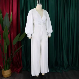 Elegant white beaded mesh wide-leg jumpsuit with lantern sleeves on a fashion mannequin.