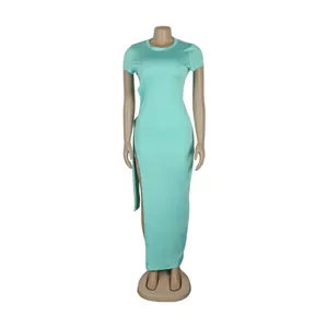 Frontal detail of a mint green bodycon maxi dress featuring a high side slit on a mannequin
