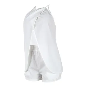 Side view detail of a white halter neck top and shorts set with back slit design