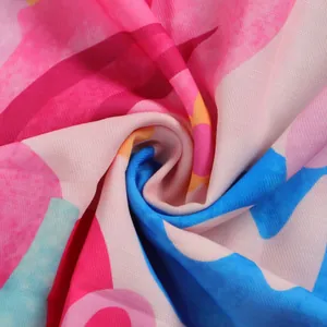 Detailed close-up showing the vibrant abstract printed fabric texture for a slim fit dress