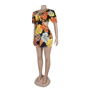 Elegant floral print cut-out romper dress featuring ruffle sleeves and a V-neckline.