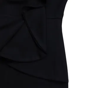 Close-up of the elegant black ruffle detail and fine fabric texture on a stylish dress.