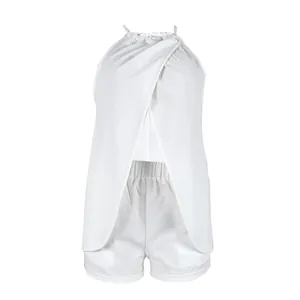 Detailed view showing the wrap front and crinkle texture of this white two-piece set.