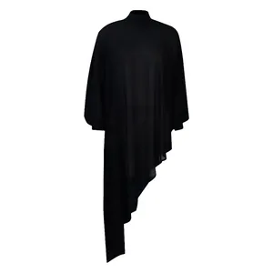 Macro detail of high neck black chiffon dress featuring an asymmetrical flowing hemline