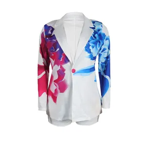 Detailed view of vibrant blue and pink floral patterns on white blazer suit set.