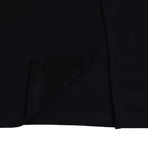 Close-up view of the high-quality stitching and ruffle detail on this elegant black dress.