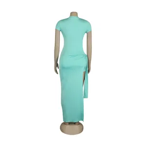 Back view of mint green slim fit two-piece set with high slit and tie detail skirt