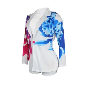 White blazer and shorts set with vibrant large blue and pink floral print details