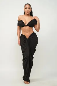 Elegant black off-shoulder pleated two-piece set featuring a floor-length maxi skirt for women