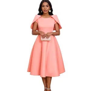 Elegant coral pink cape-style party dress with a wide swing skirt and A-line silhouette.