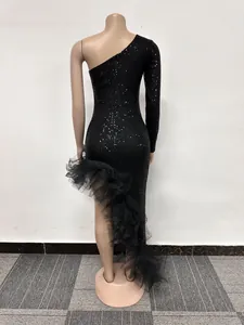 Detailed back view of a one-shoulder black sequin dress with irregular mesh ruffle hem