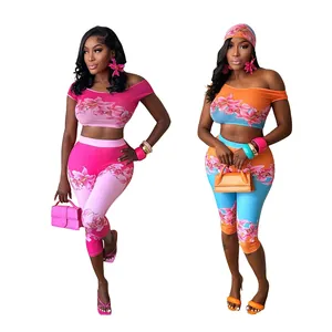 Floral print off-shoulder crop top and high-waist pants set for women in vibrant colors.
