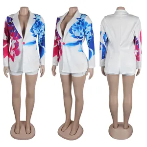Detail view of white blazer and shorts set with vibrant blue and pink floral print