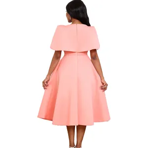 Back view of elegant peach midi dress with capelet detailing for evening parties