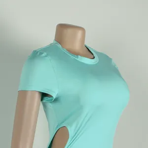 Close-up detail of a light turquoise tight stretch dress featuring a side cutout on a mannequin