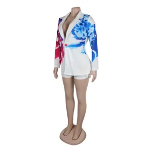 Elegant white blazer and shorts set with vibrant blue and pink floral prints