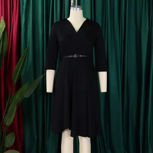 Full front view of elegant black V-neck A-line dress with skinny belt on mannequin