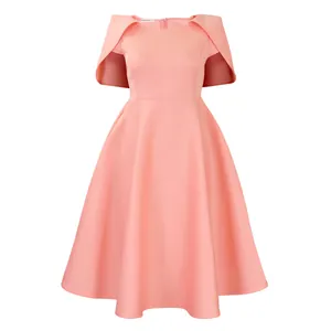 Elegant peach pink cocktail dress featuring unique cape-style shoulders and a flared A-line skirt