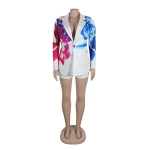 Trendy women's floral print long-sleeved blazer and matching shorts set on mannequin
