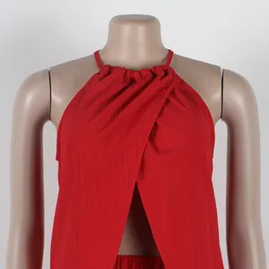 Sexy red halter neck sleeveless top featuring a stylish front slit detail on mannequin