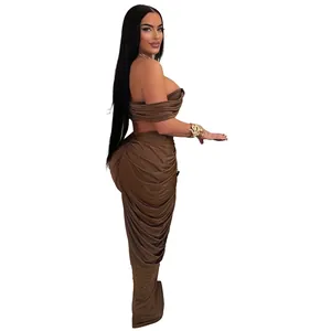 Detail view of brown ruched two-piece set featuring off-shoulder top and maxi skirt.