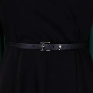 Detailed close-up view of black high-waisted dress with a thin leather belt and silver buckle
