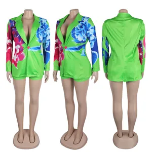 Detailed three-angle view of green floral blazer and shorts set on mannequin