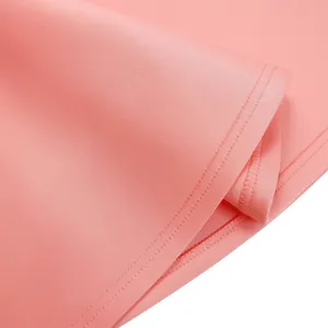 Detailed view of pink party dress hem showing high-quality double-needle stitching