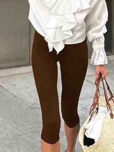 Stylish brown high-waist capri leggings for yoga and casual wear with slimming effect
