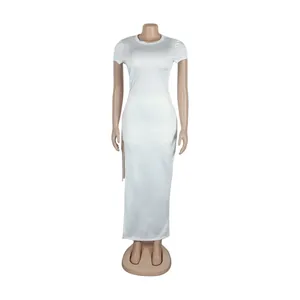 Full view detail of white two-piece set with side slit skirt and lace-up features
