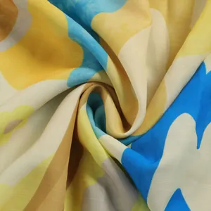 Macro close-up detail of soft abstract floral print fabric with linen texture for slim dress