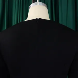 Detail view showing the back zipper closure on this black wide-leg jumpsuit garment