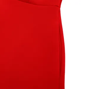 Close-up macro detail of the functional side seam pocket on a red elegant party dress