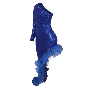 Close-up detail of blue sequin one-shoulder dress with irregular mesh ruffle hemline