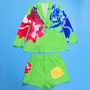 Vibrant green floral print blazer and shorts two-piece set for summer fashion.