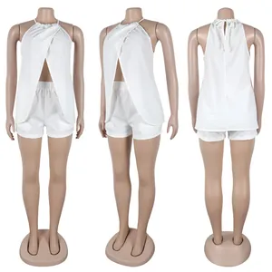 Detailed view of white sexy halter neck split sleeveless two-piece set on mannequin