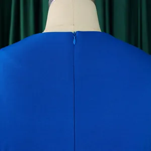 Close-up view of the invisible back zipper on this royal blue dress featuring textured fabric
