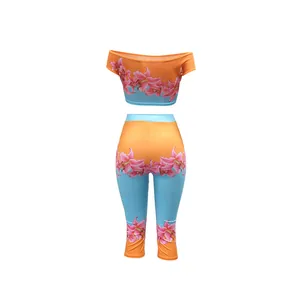 Detailed view of two-piece floral set with off-shoulder top and capri leggings.