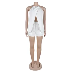 Detailed front view of white sexy halter neck split top and matching shorts on mannequin