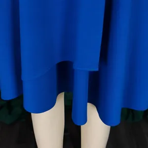Close-up of royal blue African dress hem showing fabric texture and double layered stitching.