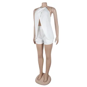 Detail of white halter slit top and shorts set on a mannequin.