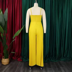 Back view of yellow pleated wide-leg jumpsuit on mannequin with spaghetti straps.