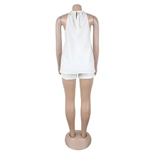 Back view of sexy white halter sleeveless two-piece set with adjustable tie back detail.