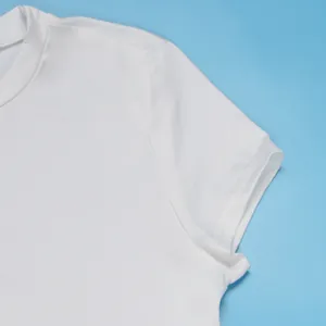 Close-up detail of white elastic t-shirt sleeve showing premium stitching and fabric texture