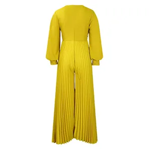 Back view of yellow pleated wide-leg jumpsuit with beaded cuffs and zipper closure.