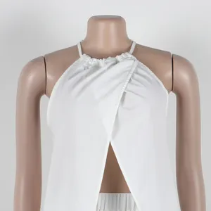 Detailed view of white halter neck top with wrap front and slit