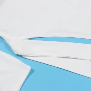 Close-up of white elastic fabric and tie details on a solid two-piece skirt set