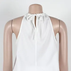 Detailed macro shot of a white sleeveless halter neck top featuring a back tie-up bow closure